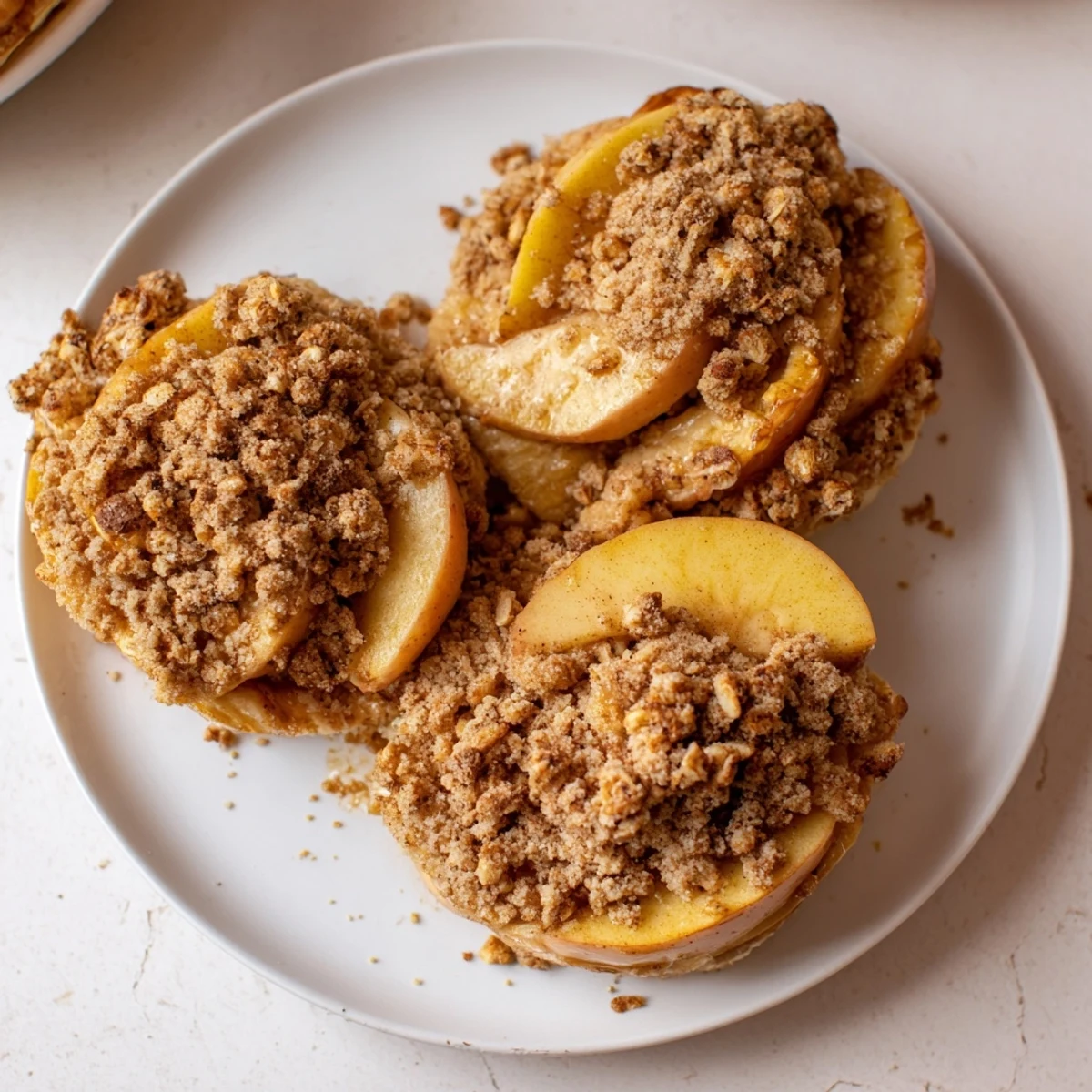 Deliciously rustic Soft Crumb Apple Crisp, served warm with vanilla ice cream, a perfect dessert.