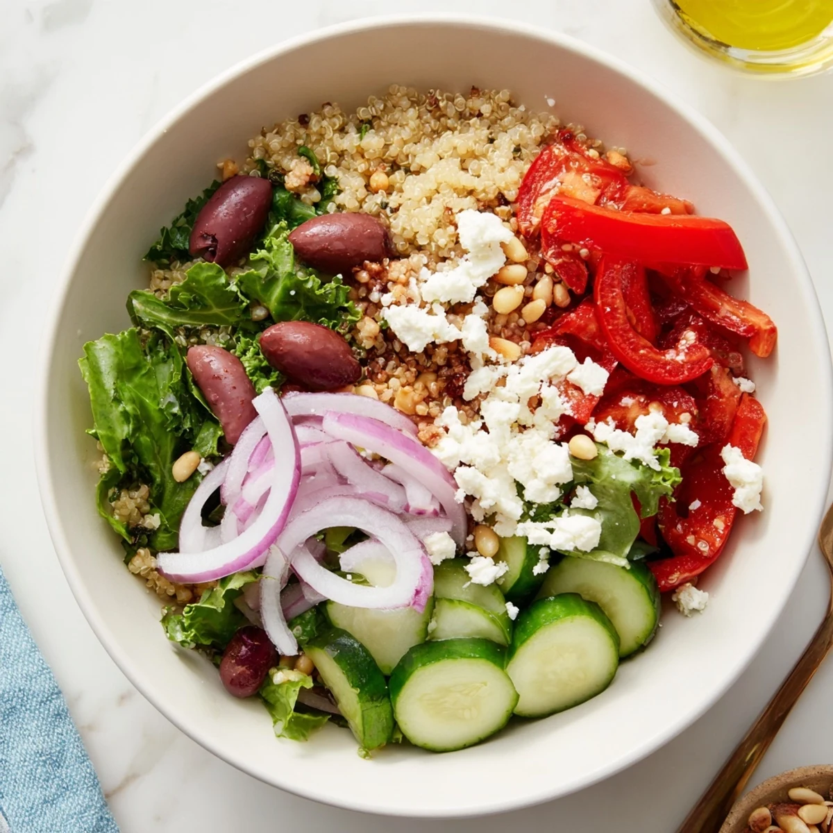Fluffy quinoa and vibrant veggies in this delicious Mediterranean Grain Bowl, ready to enjoy.