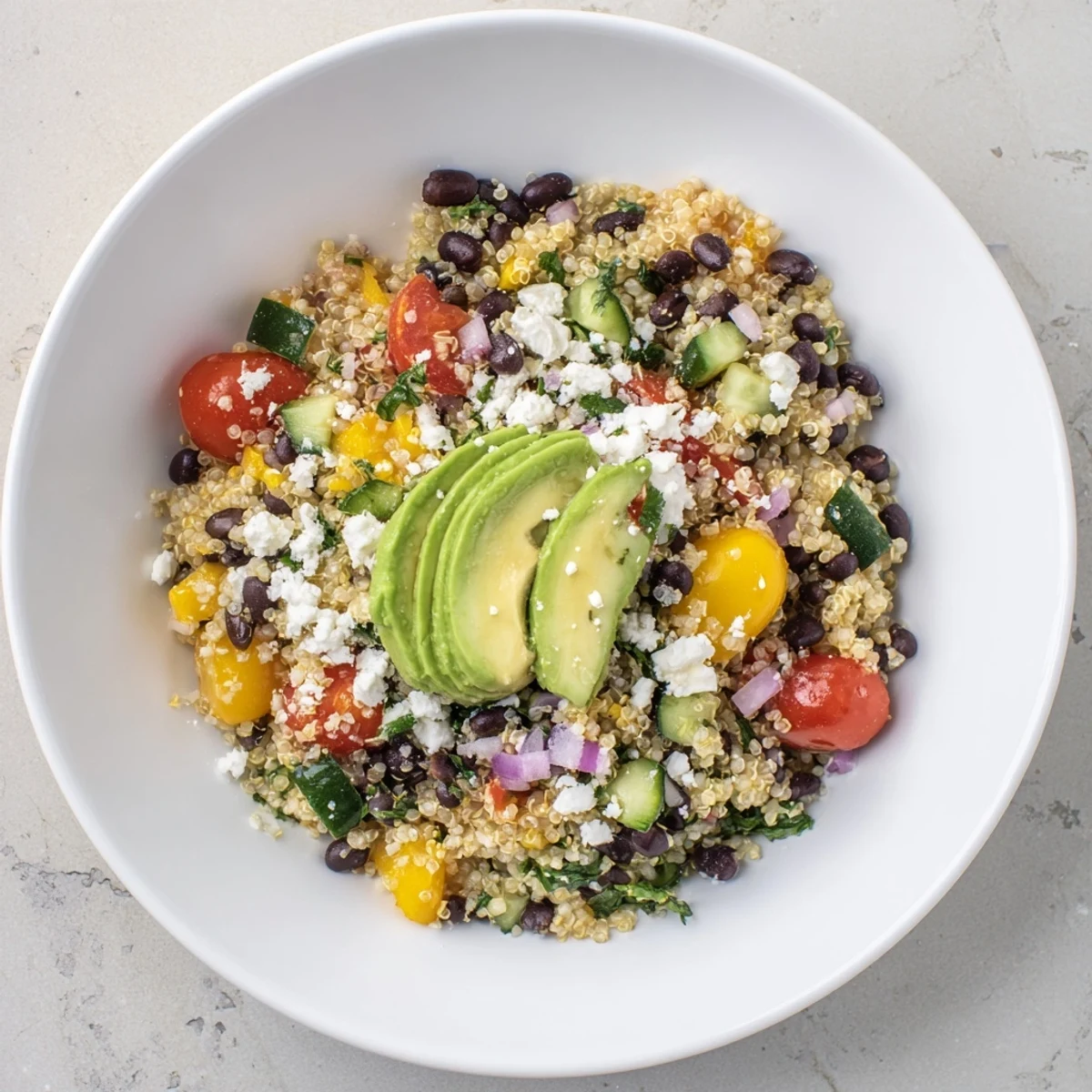 Vibrant Poppy-Bright Colorful Quinoa salad with black beans, showcasing colorful veggies and zesty dressing.