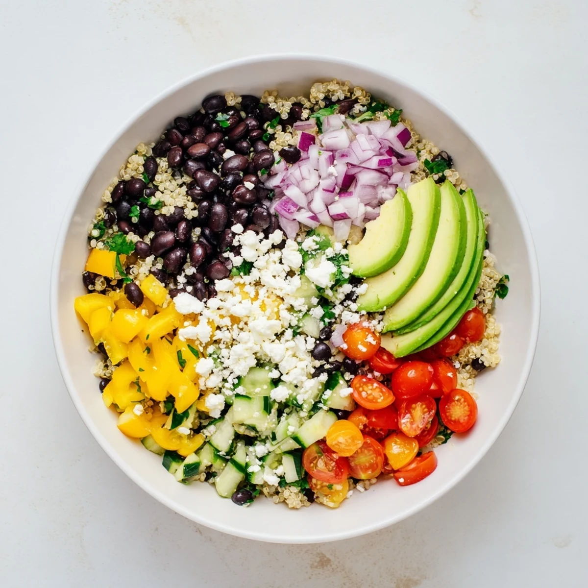 A close-up of the fresh Poppy-Bright Colorful Quinoa and black bean salad, bright and tasty on a plate.