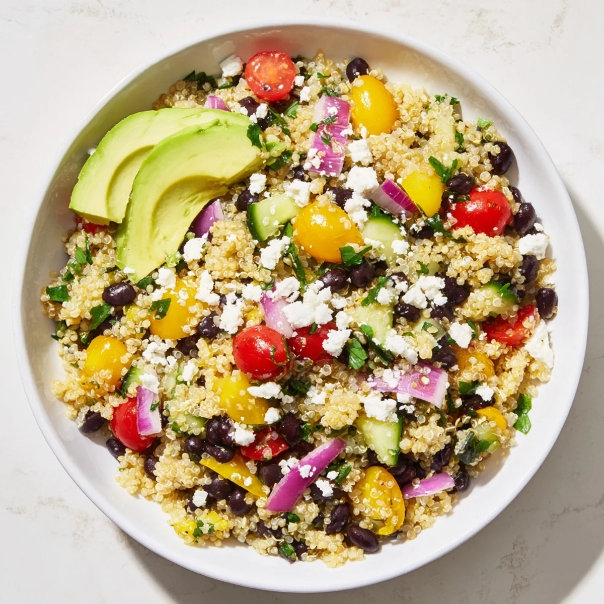 Bright, refreshing bowl of Poppy-Bright Colorful Quinoa and black bean salad with avocado, delicious and healthy.