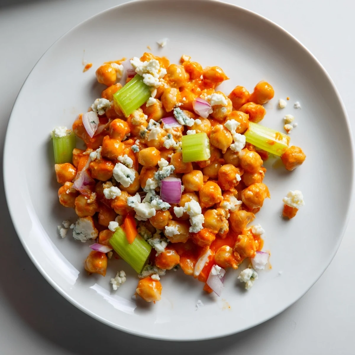 Imagine a hearty bowl of buffalo chicken bean salad, with the zing of buffalo sauce and crumbled blue cheese.