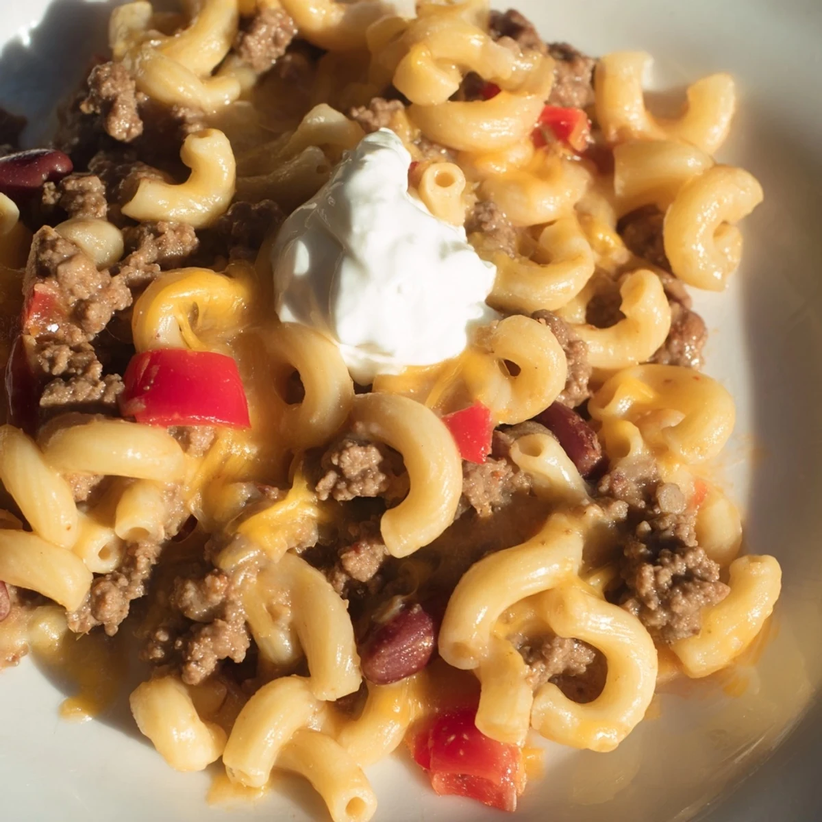 Steaming bowl of One-Pot Chili Mac with melted cheese, a flavorful and satisfying meal.