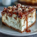 Delicious carrot cake cheesecake bars with creamy swirls and rich frosting, perfect for spring dessert tables and holiday celebrations.