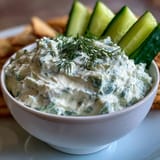 Vibrant Skyr Tzatziki Dip, boasting cool cucumber and fresh dill, perfect for dipping.
