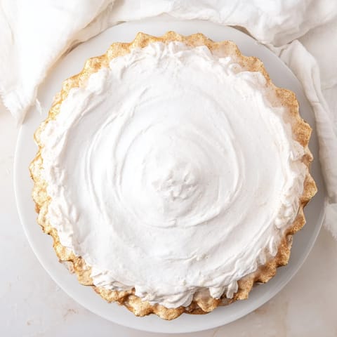 This beautiful Soft Golden Home Plate shows off a buttery, fluted crust surrounding the spiced custard.