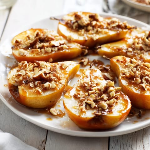 Golden, baked Maple-Warm Cozy Plate, featuring tender pears glistening with maple syrup and nuts.