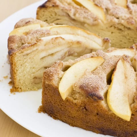 A close-up of a freshly baked Soft Crumb Apple Crisp, showing tender apples and a sweet crumble.
