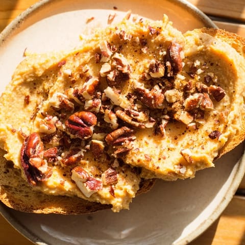 A golden brown, rustic Weekend Cabin-Style Sweet Potato and Pecan Loaf ready for cozy autumn eating.