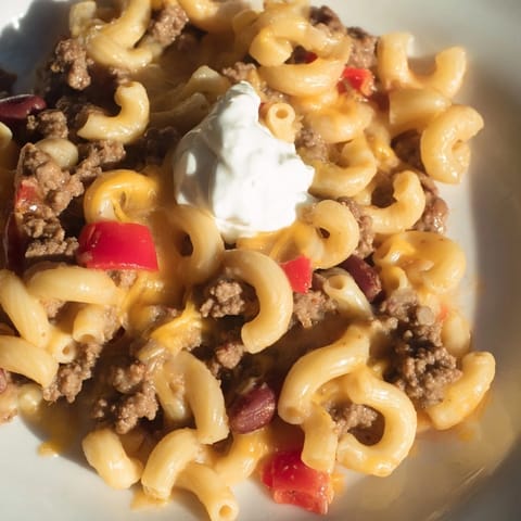 Steaming bowl of One-Pot Chili Mac with melted cheese, a flavorful and satisfying meal.
