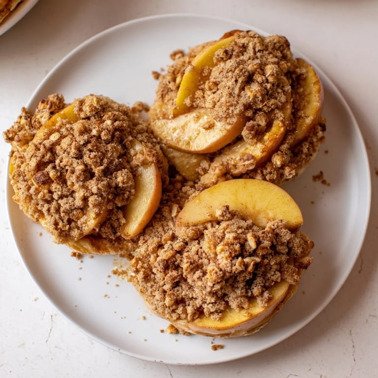 Deliciously rustic Soft Crumb Apple Crisp, served warm with vanilla ice cream, a perfect dessert.