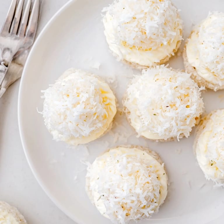 Creamy Snowball Tea Sandwich Bites, featuring soft bread and a delightful, fresh herb-infused cream cheese filling.