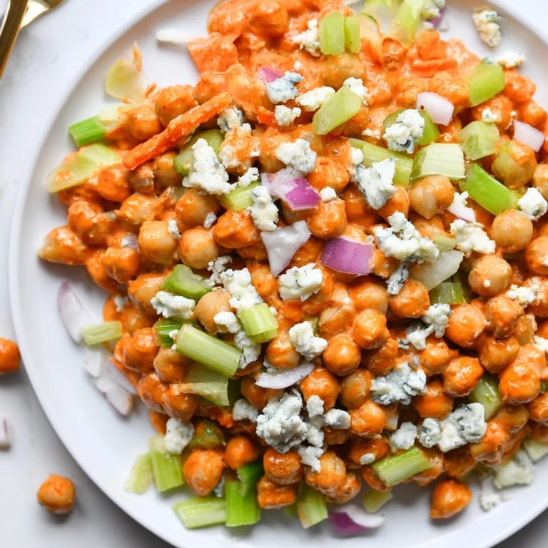 This refreshing buffalo chicken bean salad offers a delicious mix of textures and savory, bold flavors, ready to eat.