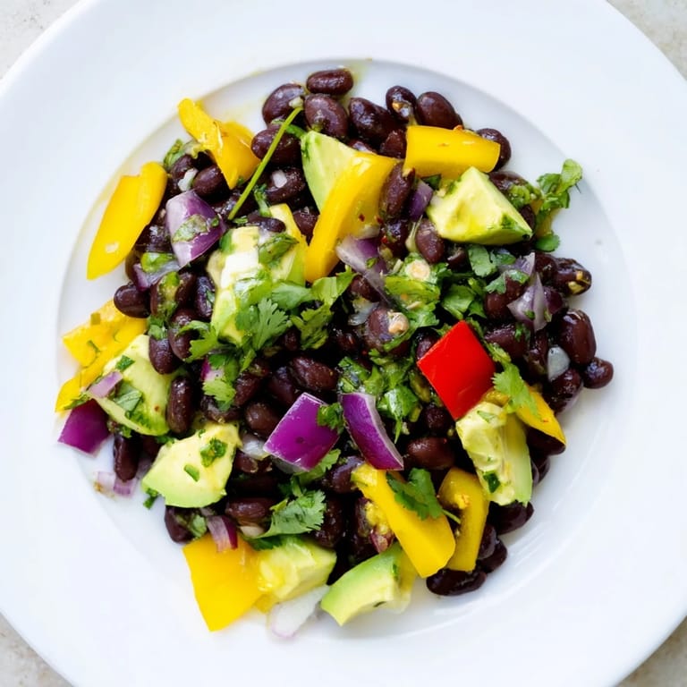 Freshly tossed Southwest Black Bean Salad, a vegetarian delight, ready to serve as a light meal.