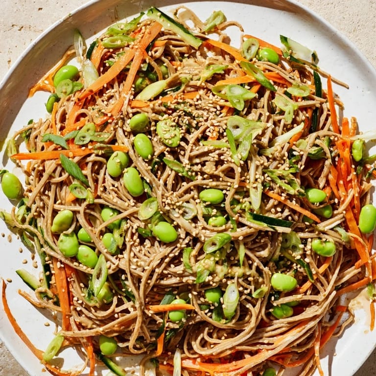 A close-up of a delightful bowl of Asian Sesame Noodle Salad, offering a tasty and healthy vegetarian meal option.